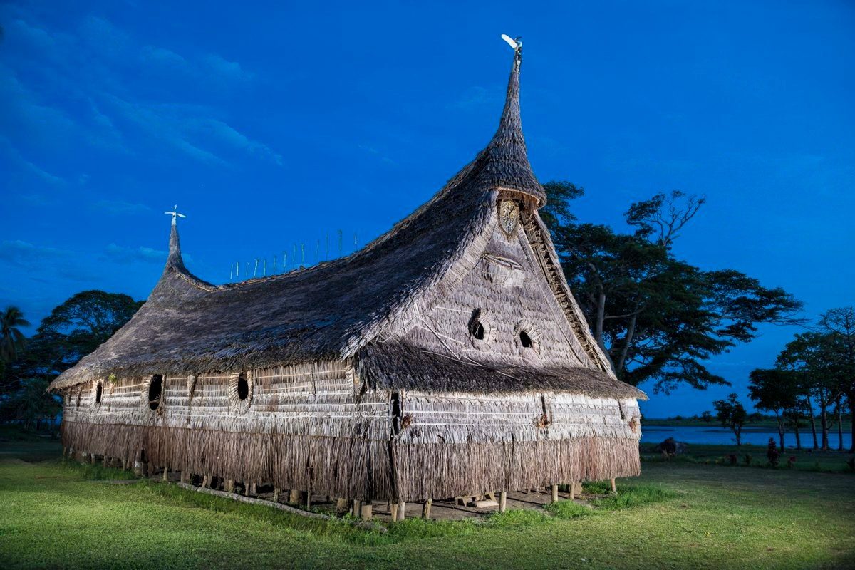 Spirit house (haus tambaran) on the banks of the Sepik at dusk